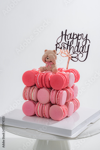 birthday cake with macaroons and candles food anniversary concept cover banner background. Macaroons cake
