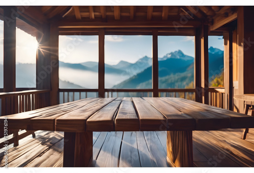 Wooden terrace with panoramic mountain view at sunrise, tranquil nature scene. © Tetlak