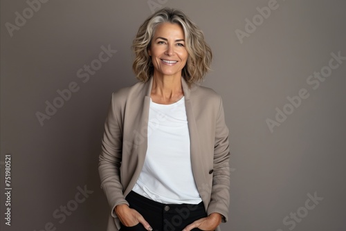 Portrait of a happy mature businesswoman smiling at the camera.