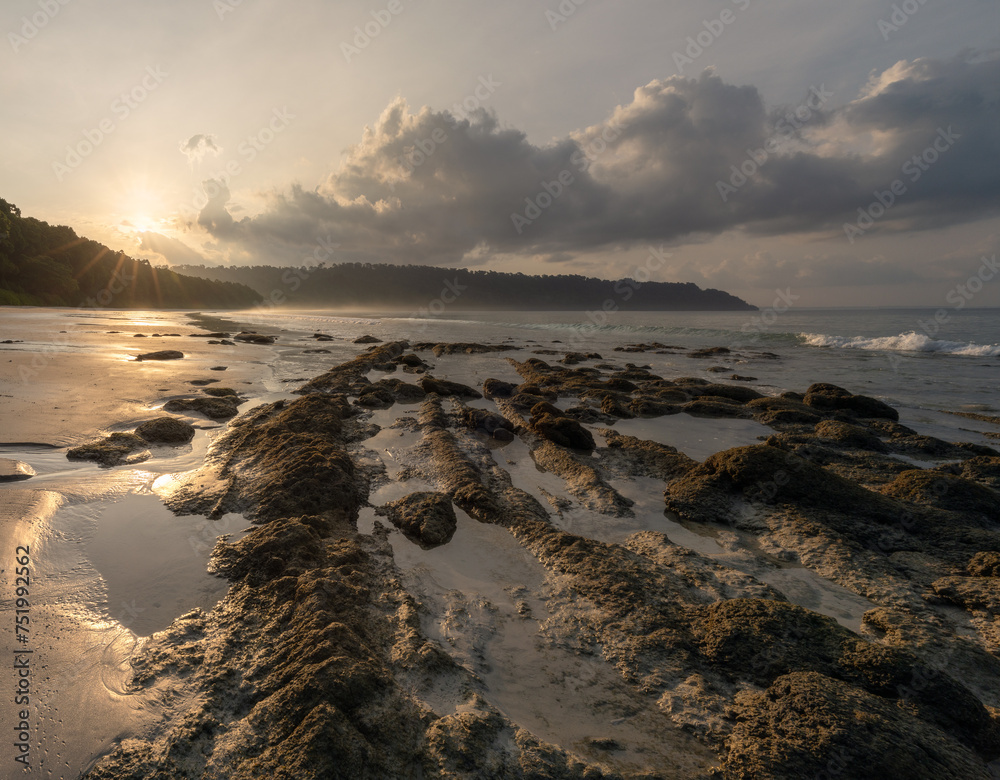 Magnificent sunrise light rays at the famous Radhanagar beach in Havelock or Swaraj Dweep island of Andaman archipelago in India