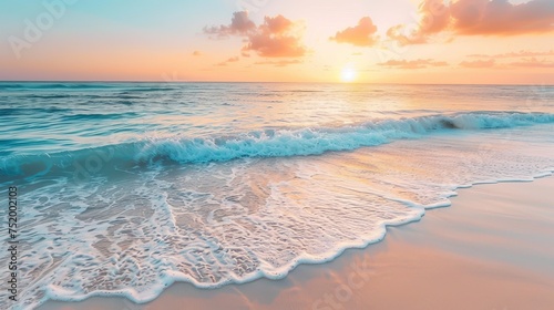 Pristine beach landscape at sunset with calm waves and a serene sky reflecting tranquil colors