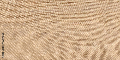 Cream abstract Hessian or sackcloth fabric or hemp sack texture background. Wallpaper of artistic wale linen canvas. Blanket or Curtain of cotton pattern with space for text decoration.