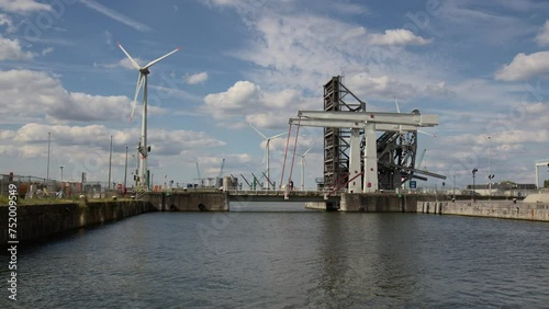 Wind turbines and the Building of Lillo Bridge at the Port of Antwerp, Belgium - Wide Shot




 photo