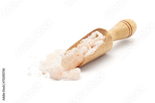 Front view of a wooden scoop filled with Organic Himalayan pink rock salt (sodium chloride). Isolated on a white background. photo