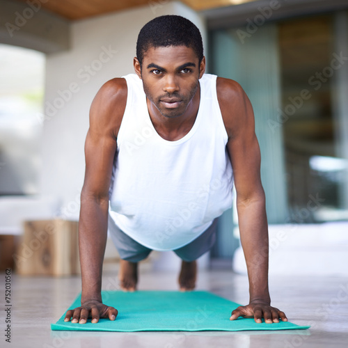 Fitness  yoga and portrait of black man in home for wellness  flexibility and balance for healthy body. Training  pilates and person on sports mat for stretching  workout and exercise in living room