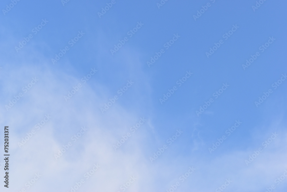 Obraz premium beautiful blue sky and white fluffy cloud with sunrise in the morning, natural background
