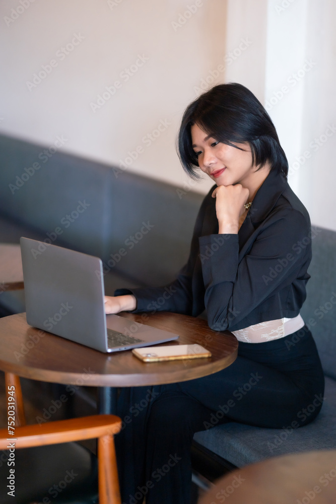 Portrait of asian freelance people businesswoman casual working with laptop computer in cafe interior in coffee shop background,business expressed confidence embolden and successful concept Portrait of asian freelance people businesswoman casual working with laptop computer in cafe interior in coffee shop background,business expressed confidence embolden and successful concept