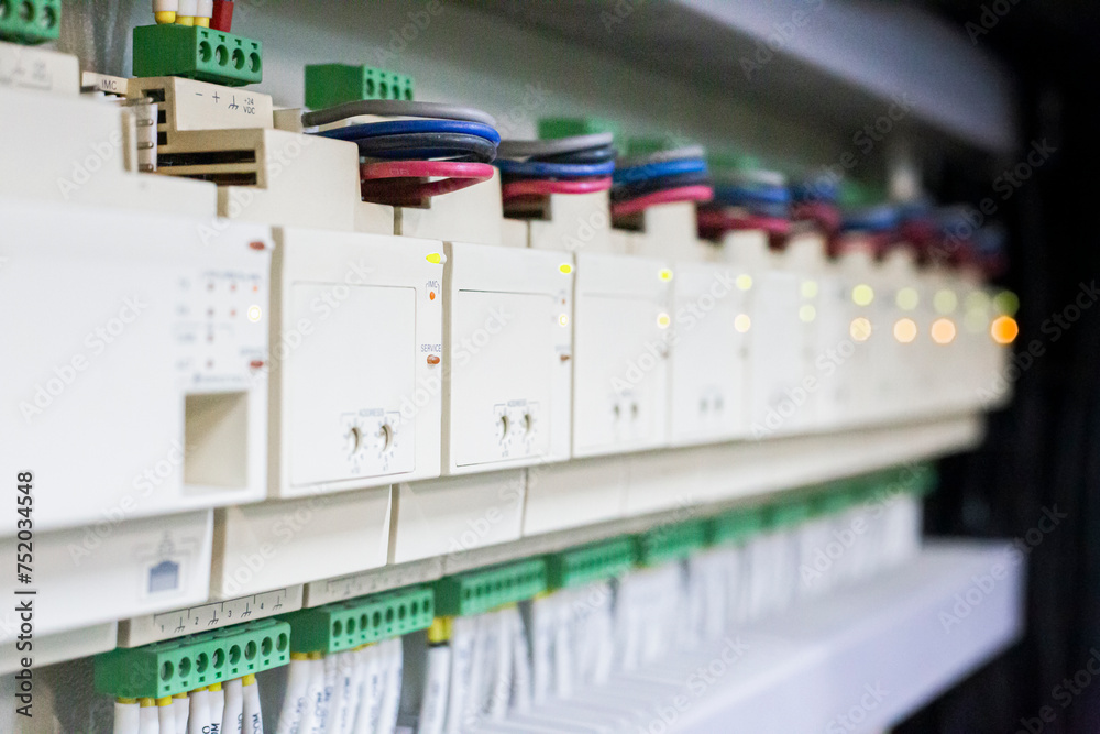 Electrical control devices are installed in a row.