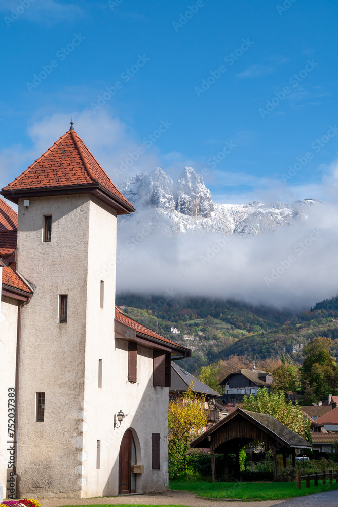 village of Duingt in the Alps, snow-capped mountain in  background