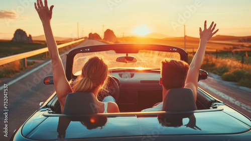Happy couple driving convertible car on the road, Boyfriend and girlfriend with arms up having fun