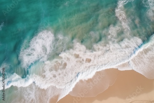 Aerial View: Turquoise Ocean Waves Crashing onto Light-Colored Sandy Shore