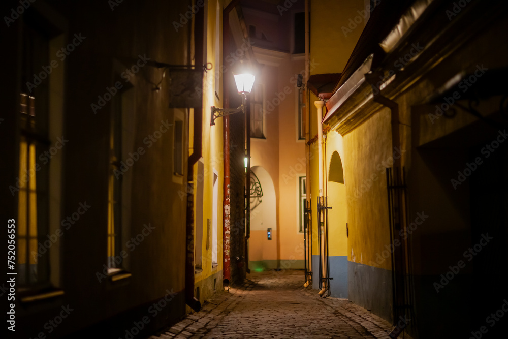 Empty night alley street in old town Tallinn Estonia