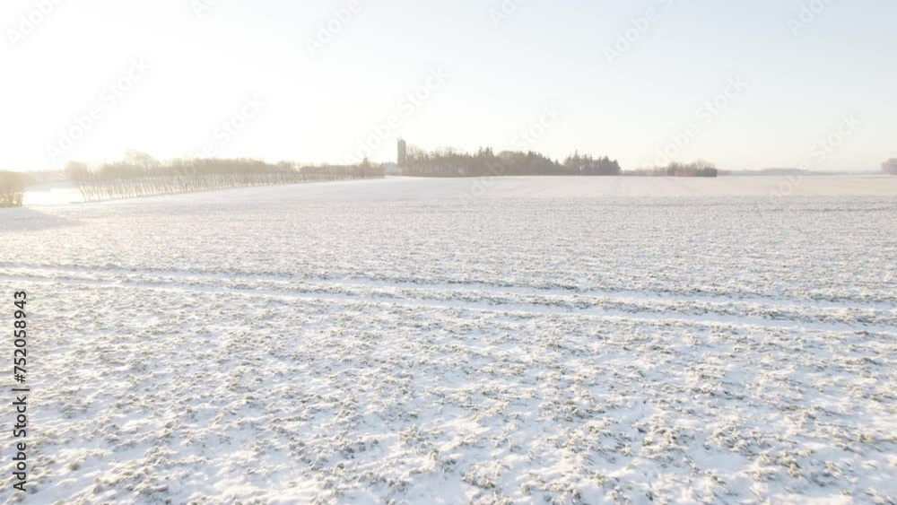 Flying Over Aerial Agricultural Field Covered By Snow at Low Altitude Flying Over Aerial Agricultural Field Covered By Snow at Low Altitude