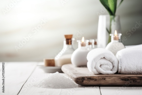 White towels on wooden tray with flowers, ideal for spa and wellness concepts