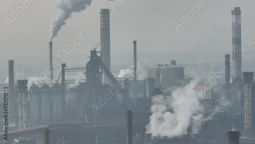 Aerial view of Coking Plant factory. Coke plant.Heavy industry in Europe, Poland, Dabrowa Gornicza. Air pollution from chimneys. Gas combustion in a coking plant.Ecology and environmental.  photo
