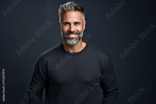 Portrait of a handsome middle-aged man in a black sweater.