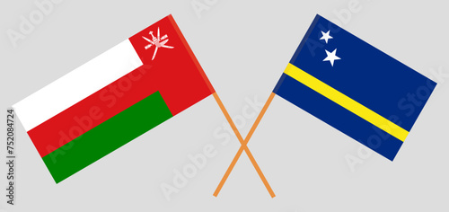 Crossed flags of Oman and Country of Curacao. Official colors. Correct proportion