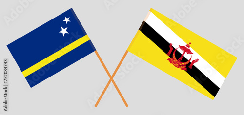 Crossed flags of Country of Curacao and Brunei. Official colors. Correct proportion photo