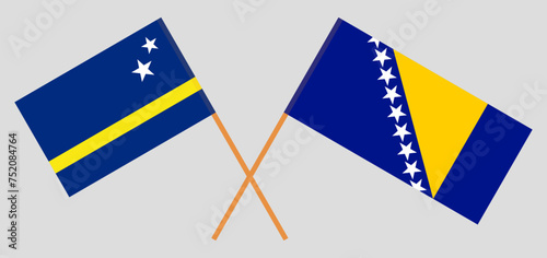 Crossed flags of Country of Curacao and Bosnia and Herzegovina. Official colors. Correct proportion