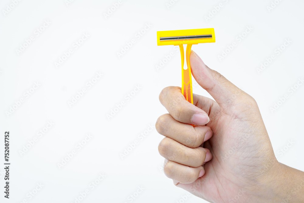 hand holding shaving razor on white background hand holding shaving razor on white background