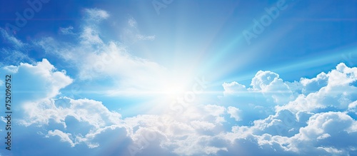 Dancing Clouds Under the Sun in a Radiant Blue Sky Landscape