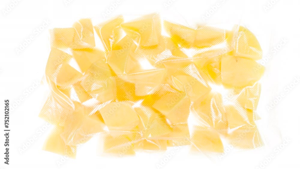 Packing and Freezing Pieces of New Potatoes. Pieces of new potatoes are packed in a vacuum apparatus and subjected to rapid cooling with an ice jet, creating the effect of white steam on a white backg Packing and Freezing Pieces of New Potatoes. Pieces of new potatoes are packed in a vacuum apparatus and subjected to rapid cooling with an ice jet, creating the effect of white steam on a white backg