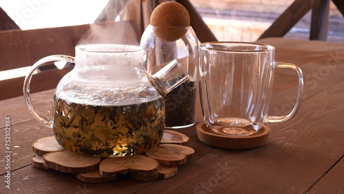 Billede på lærred Watch as hot water pours from kettle into cup tea during cold weather Enjoy comf