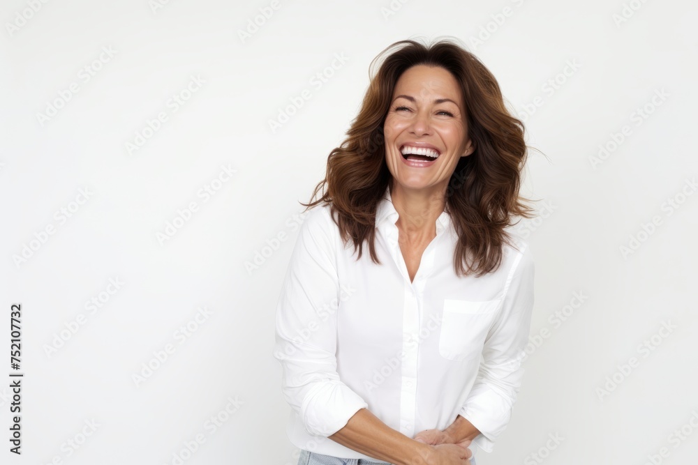 Portrait of a happy woman laughing and looking at camera isolated on a white background Portrait of a happy woman laughing and looking at camera isolated on a white background