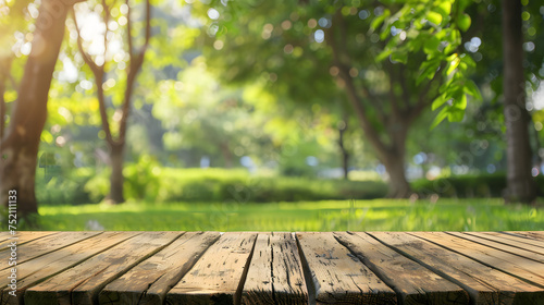 empty space on a wooden table for your product on an abstract green sunny background ,