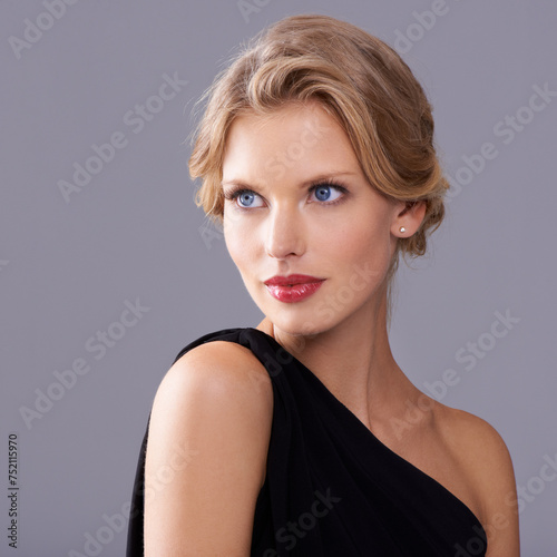 Beauty, fashion and woman in studio with makeup face for elegant, trendy and fancy dress outfit. Cosmetic, hairstyle and female model with cosmetology routine and classy style by gray background.
