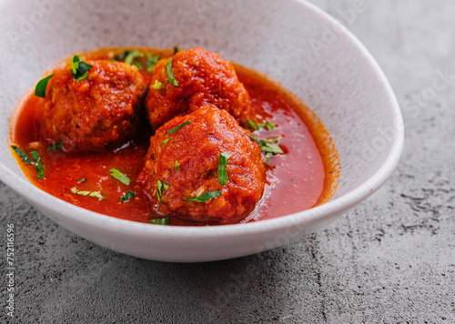 Meatballs with tomato sauce and parsley
