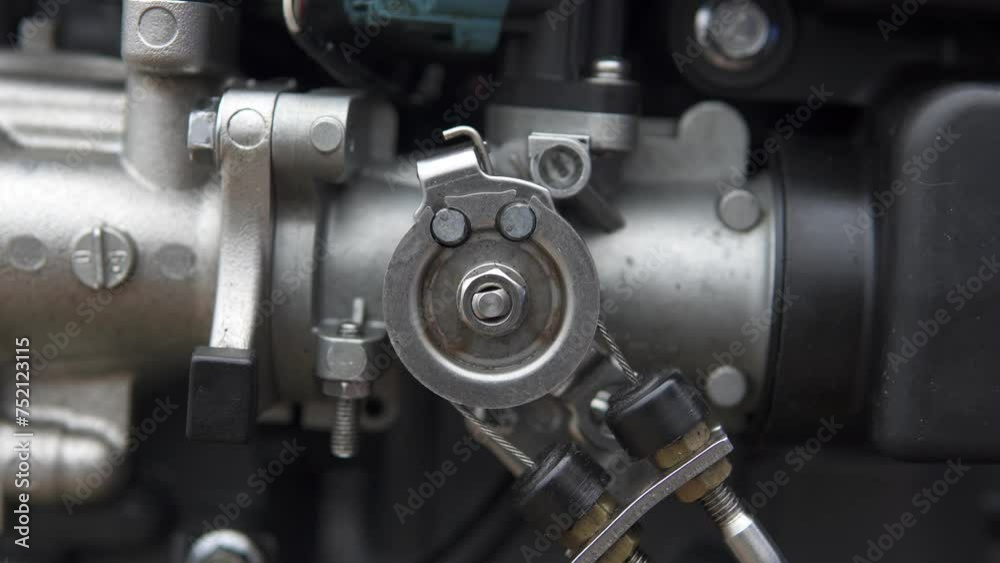 A technician diagnoses the serviceability of the throttle valve in a fuel-injected outboard motor. Repair of two-stroke and four-stroke injection and carburetor engines. A technician diagnoses the serviceability of the throttle valve in a fuel-injected outboard motor. Repair of two-stroke and four-stroke injection and carburetor engines.