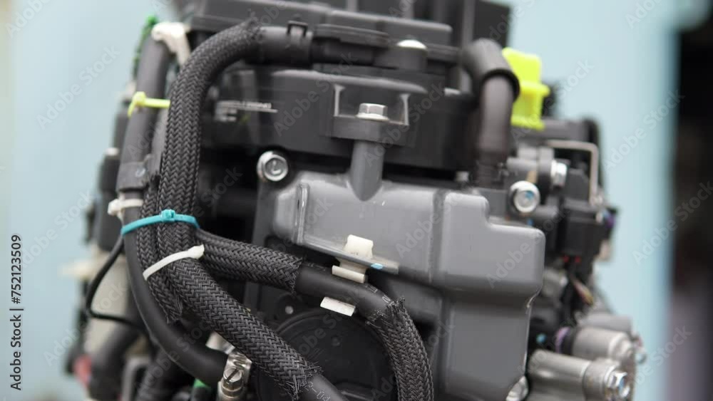 Close-up of the mechanism of an injection boat motor. Repair of two ...