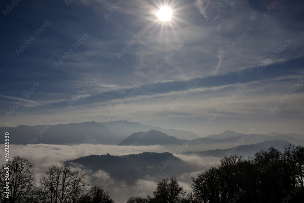 Mountain Peak Above Cloudscape in a Sunny Day in Lugano, Ticino in Switzerland.