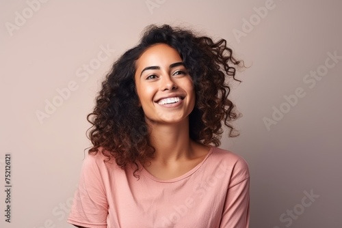 Portrait of a beautiful young african american woman with curly hair © Iigo