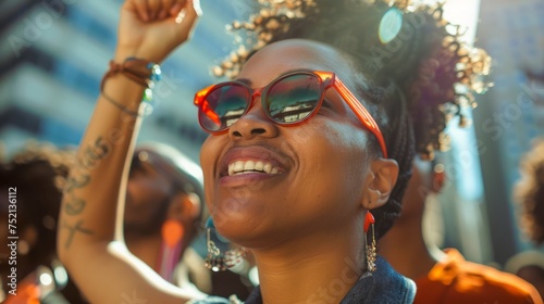 Joyful African American Woman Celebrating at Outdoor Event with Sunshine and Excitement © pisan