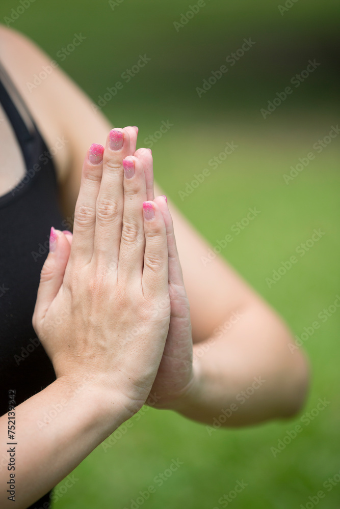 Chinese woman practicing yoga outdoors. Chinese woman practicing yoga outdoors.