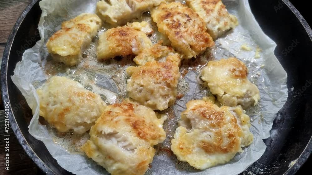 Pollock fish fried in a frying pan Pollock fish fried in a frying pan