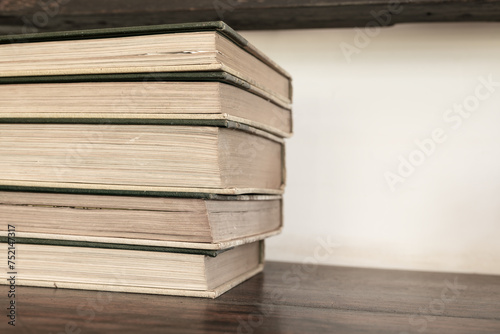 Old books on wooden table © yotrakbutda