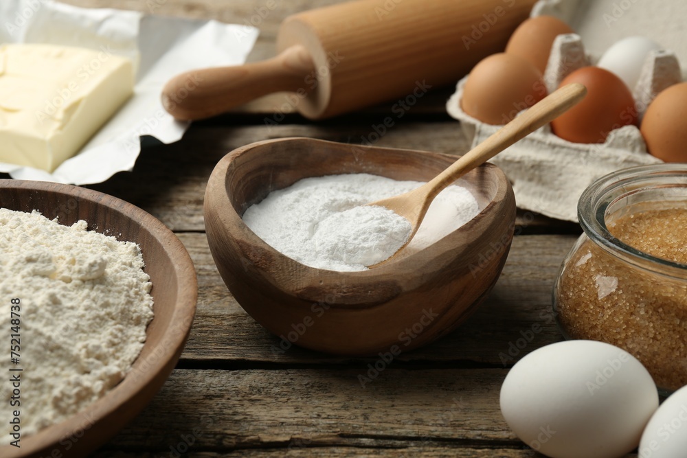 Ingredients for making dough and rolling pin on wooden table, closeup Ingredients for making dough and rolling pin on wooden table, closeup