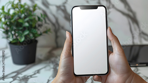 Man using smartphone blank screen frameless modern design while lying on the sofa in home interior