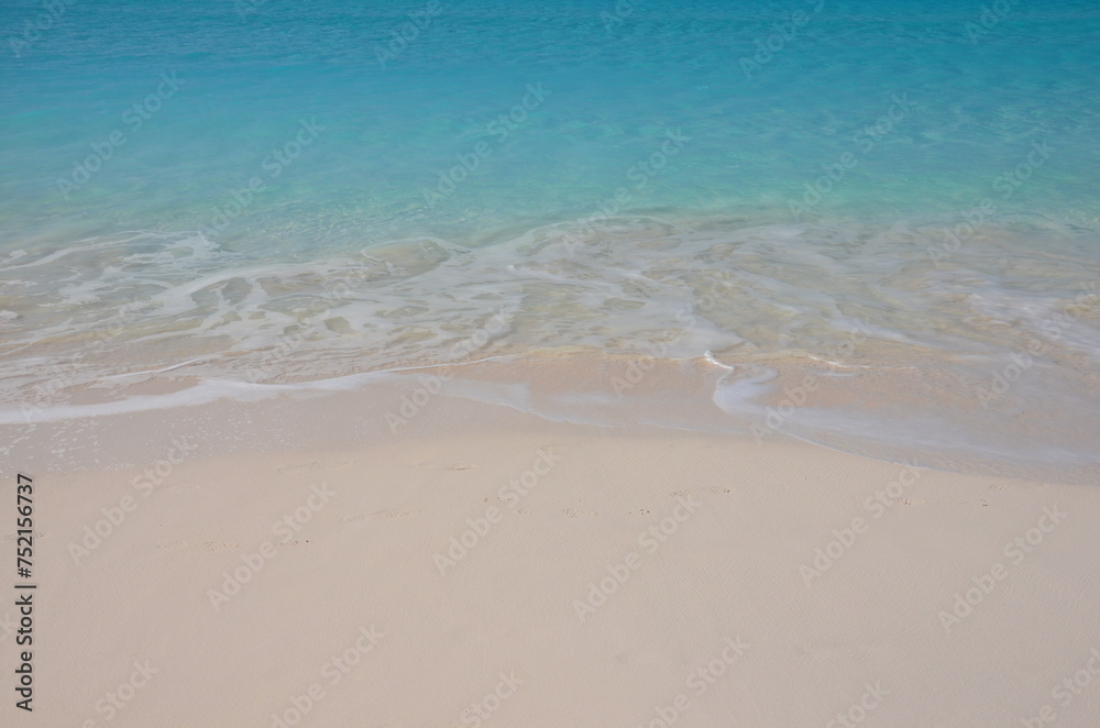 Soft blue ocean wave or clear sea on clean sandy beach Soft blue ocean wave or clear sea on clean sandy beach