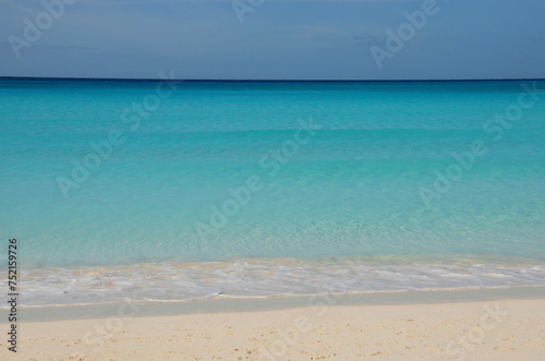 Fototapeta Naklejka Na Ścianę i Meble -  Tropical beach landscape, soft turquoise sea, clear sandy beach, blue sky