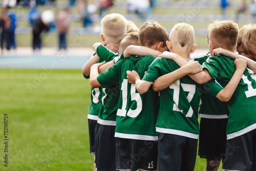Happy Boys in a Sports Team. Building Team Spirit in Junior Youth Group of Teenage Boys. Kids Standing in a Circle During Team Captain Motivational Speech. Children in School Soccer Team