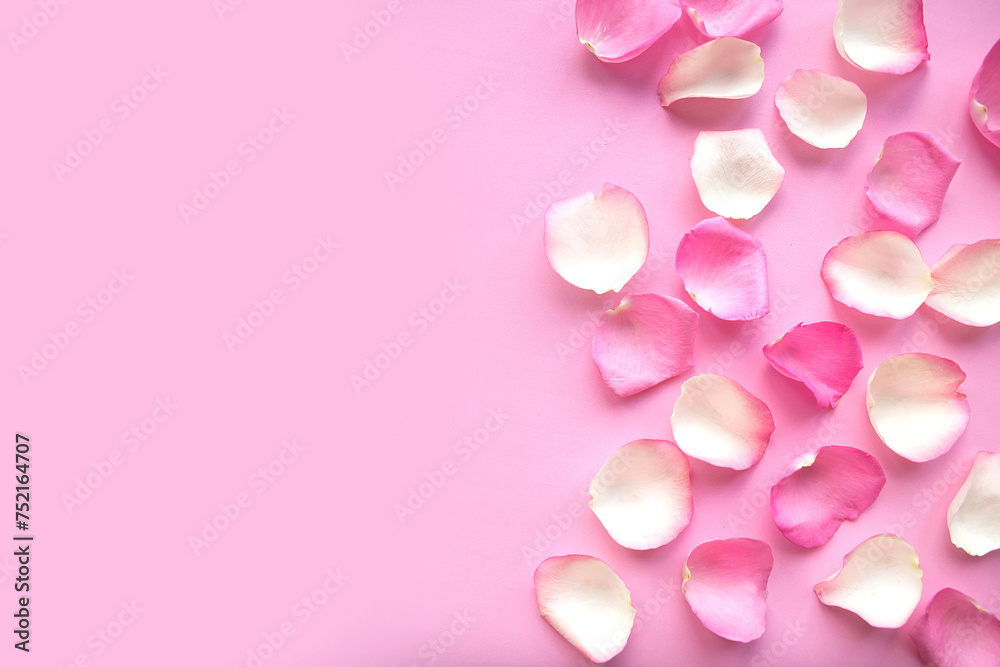 pink and white rose petals on pink background.