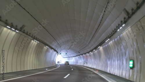Little traffic in a motorway tunnel on the Brenner Pass with new colored road boundaries and new LED lighting © tina7si