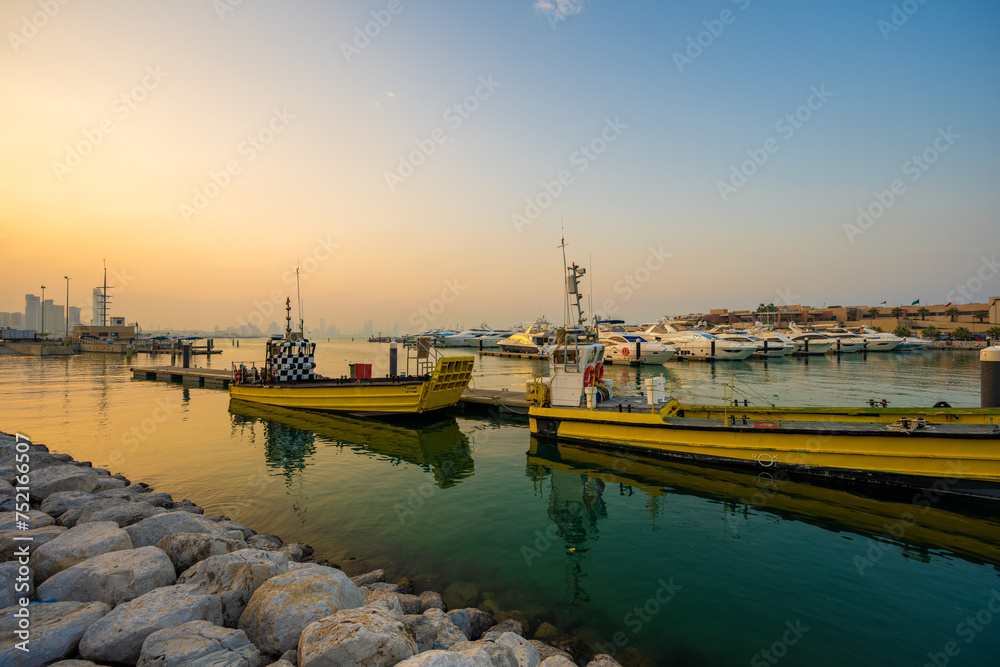 Fototapeta premium Golden Hour at Marina Crescent with Service Boats, Salmiya, Kuwait
