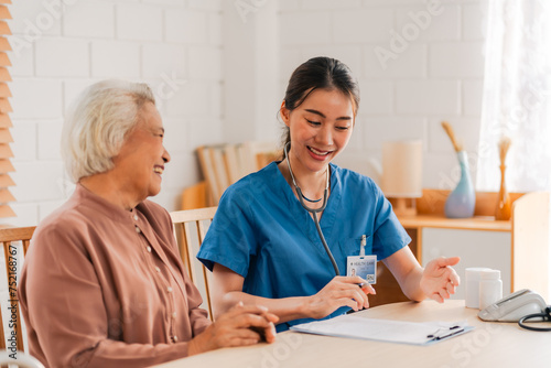 nursing home assistance in health insurance business concept, asian woman doctor or nurse caregiver support health care to elderly senior patient person, caretaker in medicals care recovery service photo
