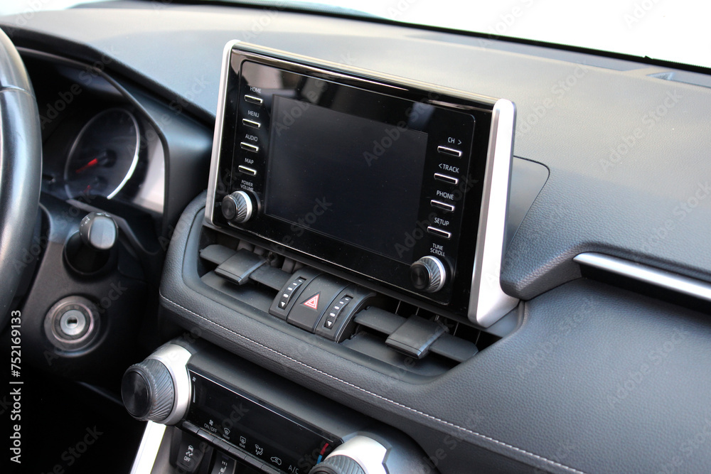 Screen multimedia system. Interior of a modern luxury car. Control panel in a modern car. Modern car dashboard.