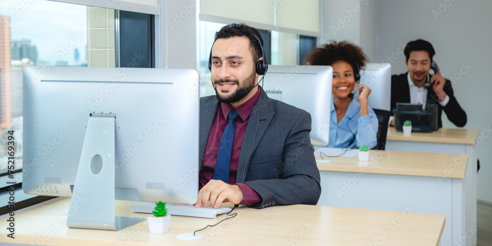 Obraz premium Customer service, call center or telemarketing team and manager or mentor looking happy reading online feedback or sale on website. Diversity people, support sales consultant training office